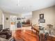 Inviting living area with hardwood flooring that leads to the kitchen and dining areas at 4610 Westford Cir, Tampa, FL 33618