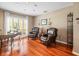 Inviting living area with hardwood floors and comfortable seating near a large window at 4610 Westford Cir, Tampa, FL 33618