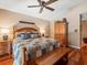 Comfortable main bedroom showcasing warm tones, hardwood floors and lots of space at 4610 Westford Cir, Tampa, FL 33618
