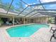 Spacious screened pool and patio area with ample seating, perfect for enjoying outdoor living at 4610 Westford Cir, Tampa, FL 33618