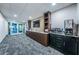 Community common area with beverage station, seating, television, and access to the fitness center at 4736 Stonebriar Dr, Oldsmar, FL 34677