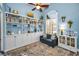 Cozy living room featuring built-in bookshelves, a comfortable sofa, and a large window at 4736 Stonebriar Dr, Oldsmar, FL 34677
