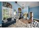 Comfortable living room with a window, stylish decor, and plush seating at 4736 Stonebriar Dr, Oldsmar, FL 34677