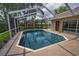 Captivating screened-in pool area with seamless outdoor access and well-maintained deck and landscaping at 4736 Stonebriar Dr, Oldsmar, FL 34677
