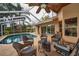 Relaxing screened-in lanai with a beautiful pool and comfortable seating area at 4736 Stonebriar Dr, Oldsmar, FL 34677