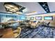 Elegant restaurant with modern lighting, stylish seating, and multiple TVs for entertainment at 4736 Stonebriar Dr, Oldsmar, FL 34677