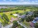 Aerial view shows the property's location near local recreational areas including ball fields and tennis courts at 5015 S 88Th St, Tampa, FL 33619