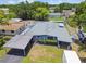 Aerial view of this charming home featuring a large yard, a carport, and a shed at 5015 S 88Th St, Tampa, FL 33619