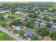 Aerial view of the home in a leafy neighborhood setting; residential and recreational amenities are visible at 5015 S 88Th St, Tampa, FL 33619