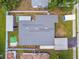 Aerial view of the home's fenced backyard, roof, and nearby small outbuildings at 5015 S 88Th St, Tampa, FL 33619
