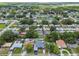 An aerial view showcases the home and its placement in a mature, green neighborhood at 5015 S 88Th St, Tampa, FL 33619