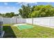 Fenced in backyard with green space and a small patio area at 5015 S 88Th St, Tampa, FL 33619