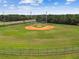 Aerial view of a baseball field showcasing well-maintained grounds, backstop, and a fenced perimeter at 5015 S 88Th St, Tampa, FL 33619