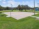 Aerial view of basketball court with hoops, a picnic table, and green space in a community park at 5015 S 88Th St, Tampa, FL 33619