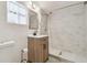 Updated bathroom features a new vanity, fixtures, and a walk-in shower at 5015 S 88Th St, Tampa, FL 33619