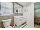 Elegant bathroom featuring a double sink vanity and decorative mirror at 5015 S 88Th St, Tampa, FL 33619