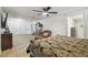 Large open bedroom featuring hardwood floors and a ceiling fan at 5015 S 88Th St, Tampa, FL 33619