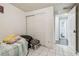 This bedroom has a double closet, and a view to the bathroom at 5015 S 88Th St, Tampa, FL 33619