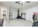 Spacious bedroom with tiled floors and additional storage area at 5015 S 88Th St, Tampa, FL 33619