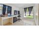 Comfortable bedroom featuring a desk, TV, and view to the outdoors at 5015 S 88Th St, Tampa, FL 33619