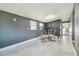Modern dining area with gray walls, tile flooring, and contemporary decor at 5015 S 88Th St, Tampa, FL 33619