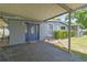 Charming home featuring a covered entrance, well-manicured shrubbery and unique door at 5015 S 88Th St, Tampa, FL 33619