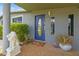 Home featuring a covered entrance, plants, and unique decorative glass door at 5015 S 88Th St, Tampa, FL 33619