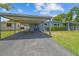 Inviting single-story home featuring a carport and well-maintained front yard at 5015 S 88Th St, Tampa, FL 33619