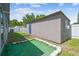 Backyard featuring a separate structure with green turf at 5015 S 88Th St, Tampa, FL 33619