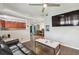 Open-concept living room flows into the kitchen with updated appliances and stylish design at 5015 S 88Th St, Tampa, FL 33619