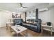 Inviting living room featuring a ceiling fan, recessed lighting, and dark grey recliners at 5015 S 88Th St, Tampa, FL 33619