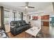 Well-lit living room with a modern ceiling fan and a convenient kitchen pass-through at 5015 S 88Th St, Tampa, FL 33619