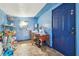 Small office space featuring blue walls and a desk with natural lighting at 5015 S 88Th St, Tampa, FL 33619