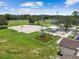 Aerial view of park featuring basketball court, covered picnic areas, outdoor exercise area, and green space at 5015 S 88Th St, Tampa, FL 33619