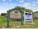 A sign for Progress Village Park, featuring information about the park's location and the Senior Center at 5015 S 88Th St, Tampa, FL 33619
