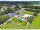 Aerial view of a colorful playground, basketball court, parking, and building in a community park with green space at 5015 S 88Th St, Tampa, FL 33619