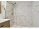 The shower features modern tile and a showerhead at 5015 S 88Th St, Tampa, FL 33619