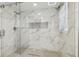 Elegant shower featuring marble tile and a sleek, modern design at 5015 S 88Th St, Tampa, FL 33619