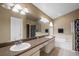 Bathroom features double sinks, a large mirror, and a separate bathtub and shower at 509 Delwood Breck St, Ruskin, FL 33570