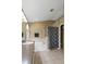 Bathroom featuring a soaking tub, shower with patterned curtain, and a separate toilet area at 509 Delwood Breck St, Ruskin, FL 33570