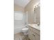 Well-lit bathroom featuring a vanity with a sink, a toilet, and a tiled shower-tub combination at 509 Delwood Breck St, Ruskin, FL 33570