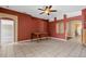 Spacious dining room featuring tile floors, a ceiling fan, and archways leading to other living spaces at 509 Delwood Breck St, Ruskin, FL 33570
