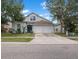 Charming two-story home with a blue front door, a two-car garage, and manicured lawn at 509 Delwood Breck St, Ruskin, FL 33570