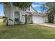 Well-maintained front yard showcasing the home's architecture and mature landscaping at 509 Delwood Breck St, Ruskin, FL 33570