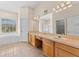 Bathroom featuring double vanity, a garden tub, and a separate walk-in shower at 5309 Spectacular Bid Dr, Wesley Chapel, FL 33544