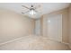 Bedroom featuring carpeted floors, a ceiling fan and a double door closet at 5309 Spectacular Bid Dr, Wesley Chapel, FL 33544