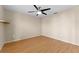 Bedroom featuring sleek hardwood floors, a modern ceiling fan, and neutral paint at 5309 Spectacular Bid Dr, Wesley Chapel, FL 33544