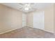 Bedroom featuring carpeted floors, a ceiling fan, and a double door closet at 5309 Spectacular Bid Dr, Wesley Chapel, FL 33544