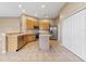 Kitchen featuring stainless steel appliances, center island, lots of cabinets, and tiled flooring at 5309 Spectacular Bid Dr, Wesley Chapel, FL 33544