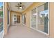 Spacious lanai with ceiling fan and sliding glass doors for seamless indoor-outdoor living at 5309 Spectacular Bid Dr, Wesley Chapel, FL 33544